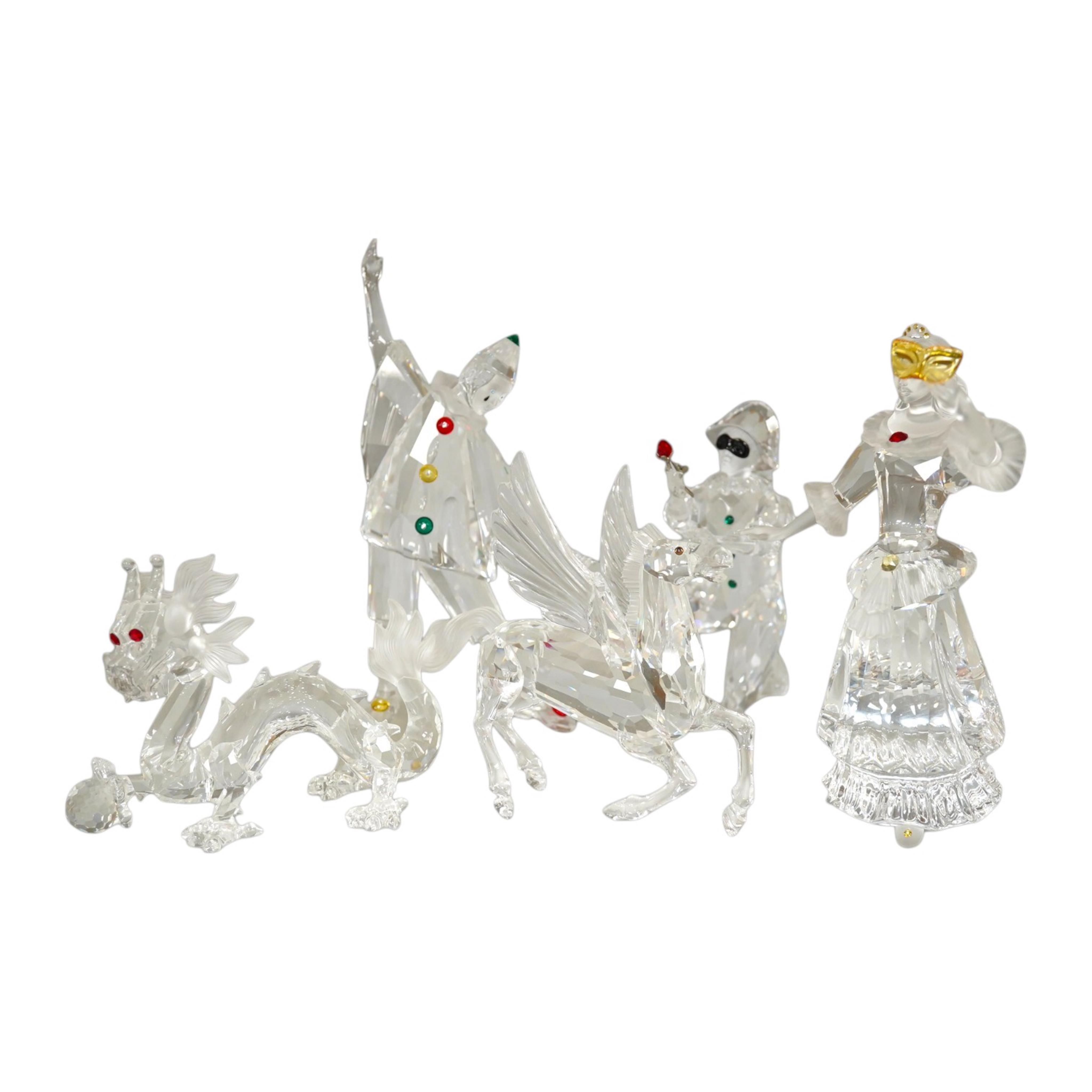 Five Swarovski crystal figures including Masquerade Columbine, Masquerade Harlequin, Masquerade Pierrot, a Chinese Dragon and Pegasus. Condition - good